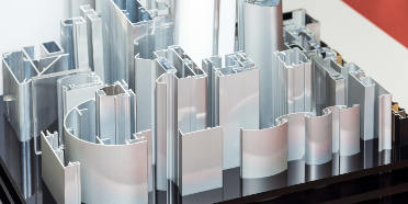 Various aluminum profiles sitting on a stand for display