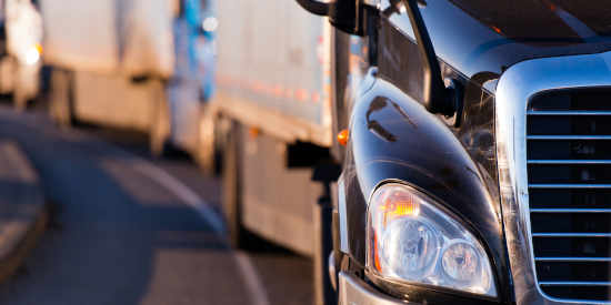 Truck Driving on Road with Aluminum Sheet