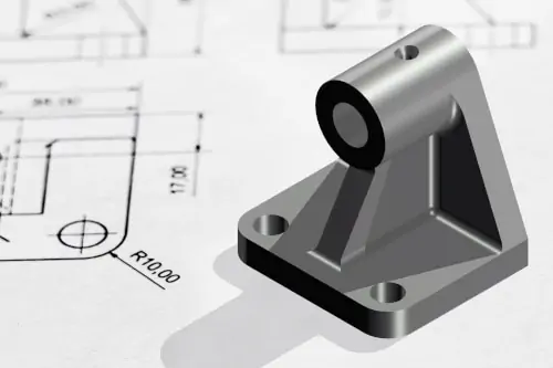 Aluminum vs. Steel: A metal part sitting on top of a part drawing