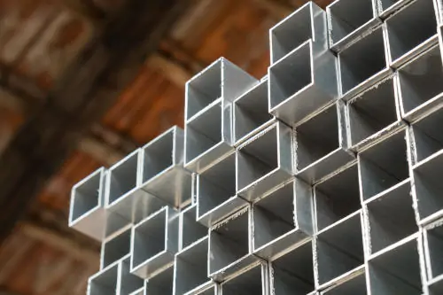 Square aluminum profiles stacked in the warehouse