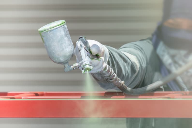 Painting metal products with spray gun