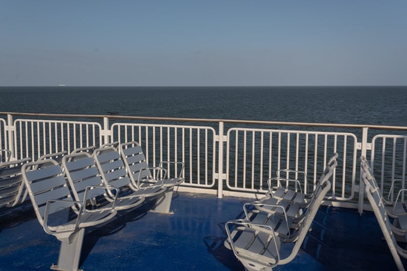 Aluminum bench seats and deck railing on a ferry ship