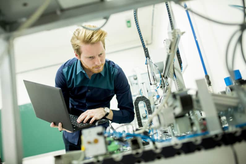 Male engineer working in a factory