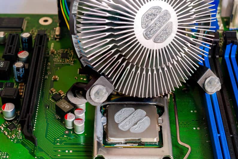 Cooling fan with extruded aluminum heat sink and CPU thermal paste applied before mounting to the motherboard