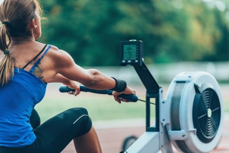 Woman working out on rowing machine